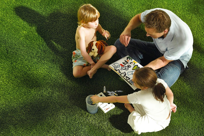 Family Playing on Fake Grass (photo)